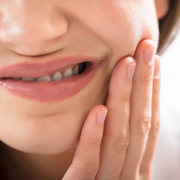 holding jaw in pain